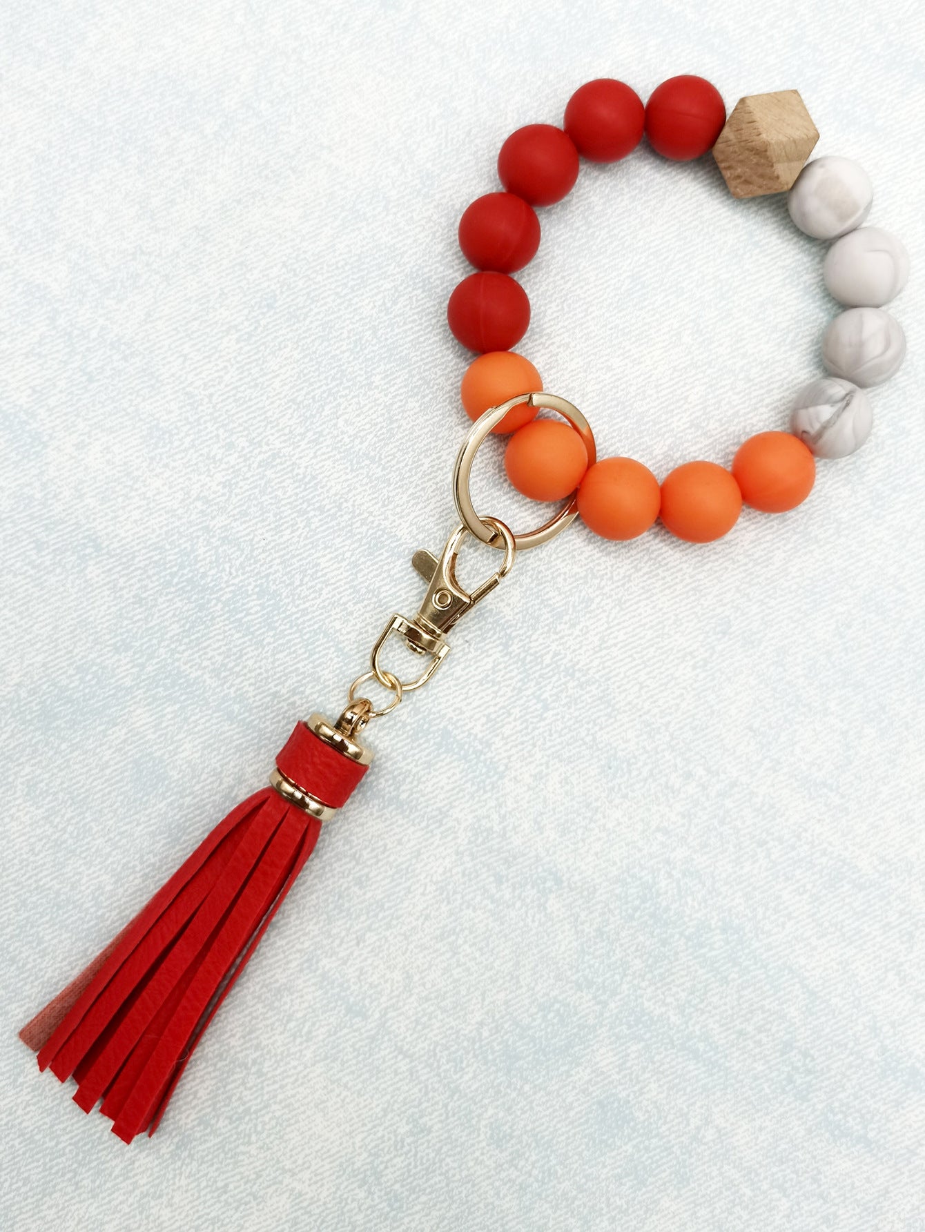 Pulsera de cuentas de silicona con borlas al por mayor llavero de muñeca